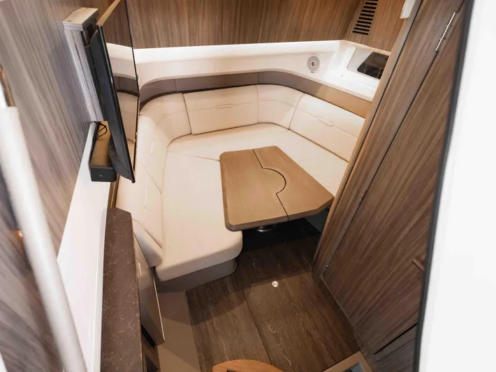  Yacht Photos Pics 2019 Sea Ray SLX 400 interior with cozy seating and wooden accents.