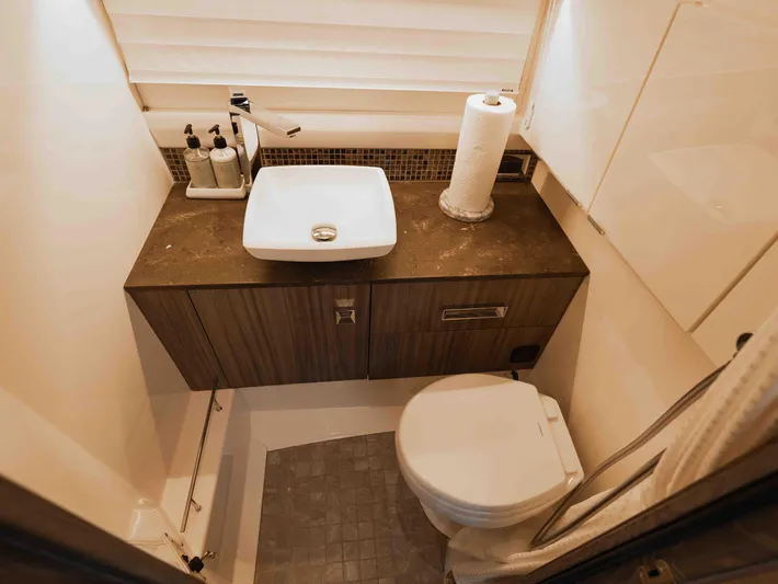  Yacht Photos Pics Luxurious bathroom interior of 2019 Sea Ray SLX 400 yacht with modern fixtures.