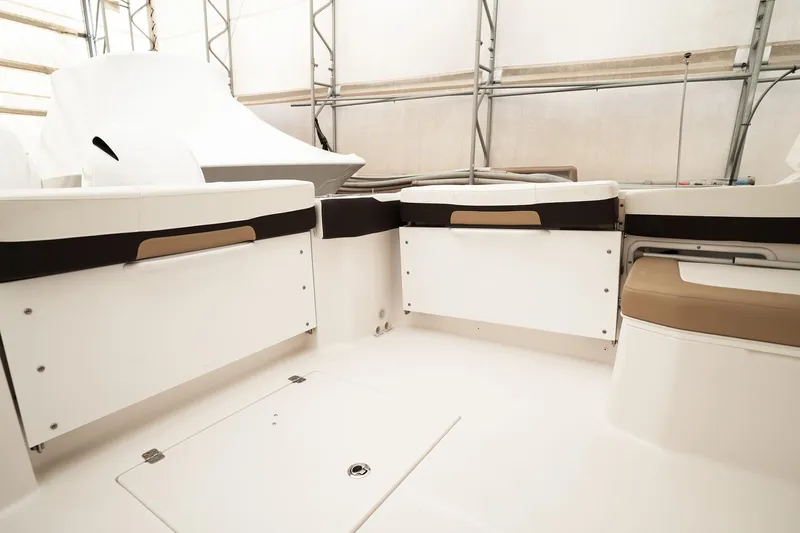  Yacht Photos Pics 2022 Edgewater 262 CX boat interior with seating and storage compartments.