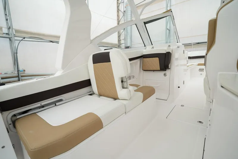  Yacht Photos Pics Interior view of 2022 Edgewater 262 CX boat with beige and white seating.