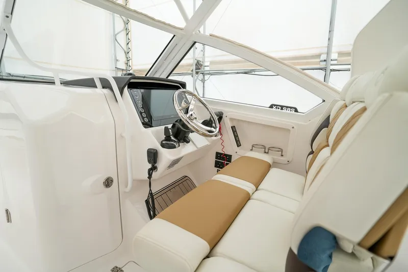  Yacht Photos Pics Interior of 2022 Edgewater 262 CX boat, featuring modern helm and comfortable seating.