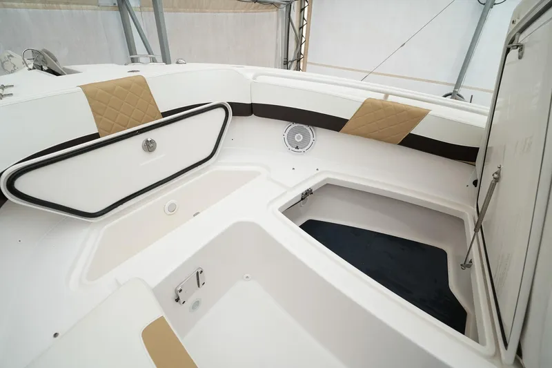  Yacht Photos Pics 2022 Edgewater 262 CX boat interior with storage compartments and cushioned seating.