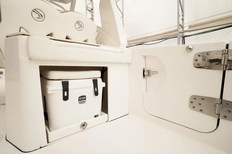  Yacht Photos Pics 2022 Edgewater 262 CX boat interior with storage compartment and cooler.