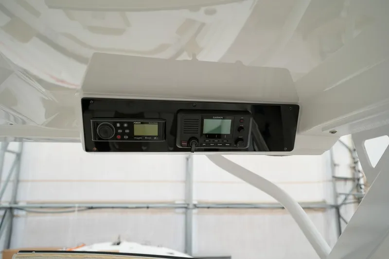  Yacht Photos Pics 2022 Edgewater 262 CX boat dashboard with electronic controls and display.