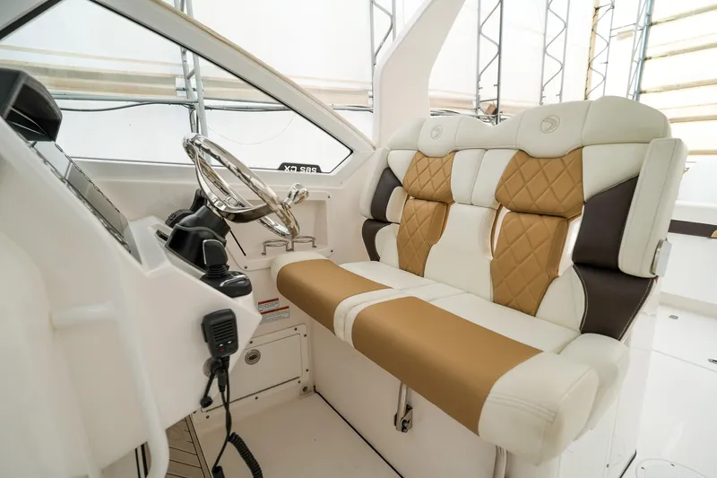  Yacht Photos Pics 2022 Edgewater 262 CX boat interior with luxurious seating and modern steering console.