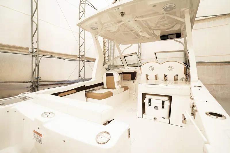 Yacht Photos Pics 2022 Edgewater 262 CX boat interior with seating and helm station.