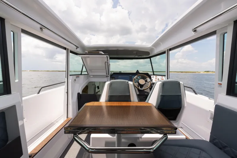  Yacht Photos Pics Interior of 2023 Axopar 37XC CROSS CABIN, featuring sleek design and modern seating.