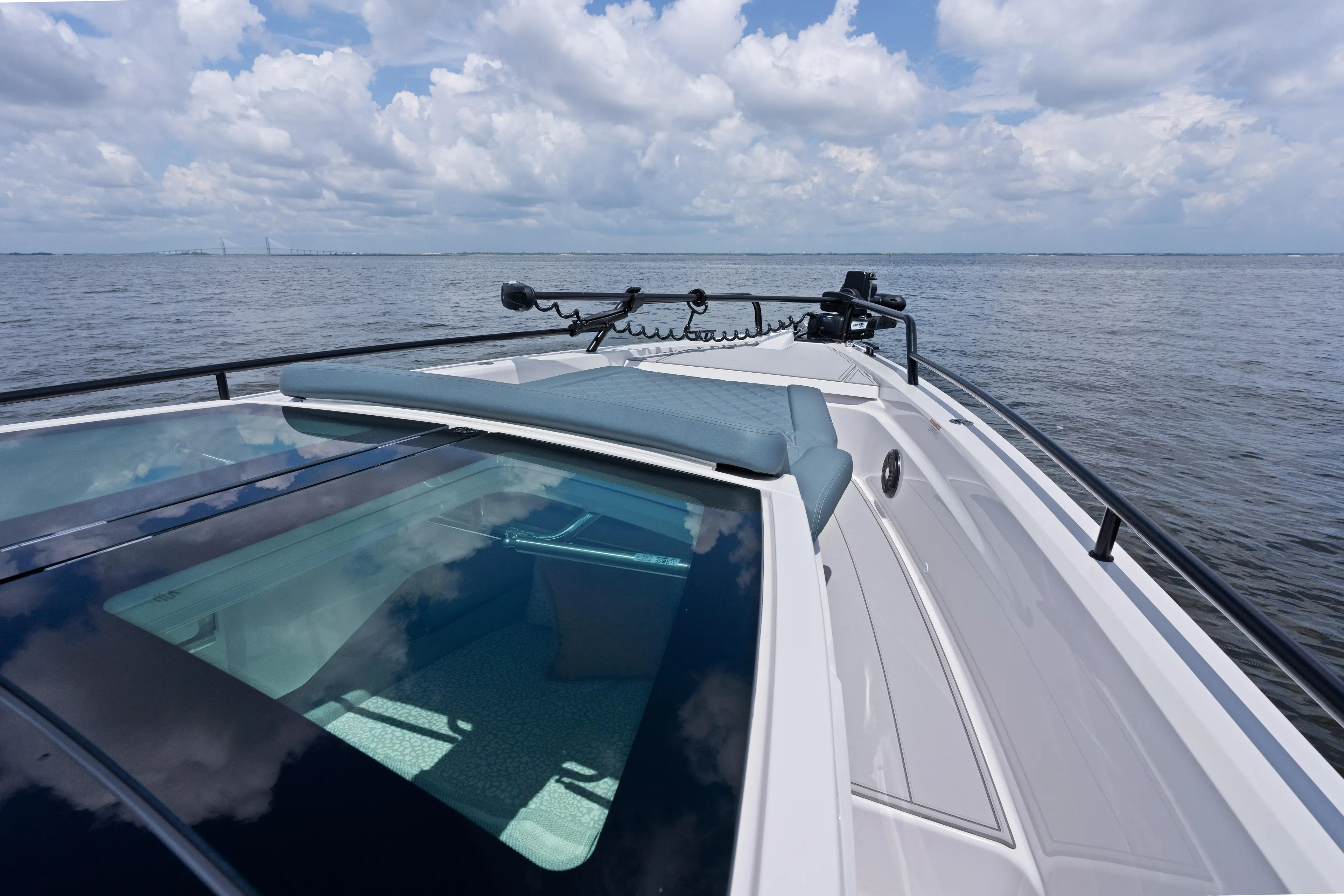  Yacht Photos Pics Axopar 37XC CROSS CABIN 2023 on open water under cloudy sky.