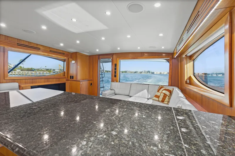 Blacksmith Yacht Photos Pics Luxurious interior of 2008 Hatteras 60 Convertible yacht with ocean view.