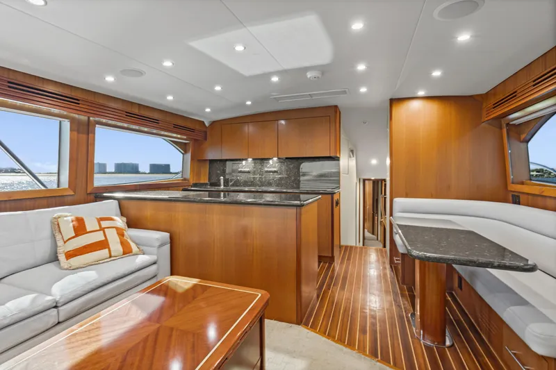 Blacksmith Yacht Photos Pics Luxurious interior of 2008 Hatteras 60 Convertible yacht with modern kitchen and seating area.