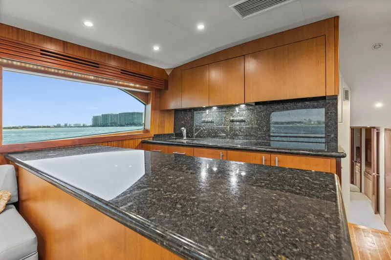 Blacksmith Yacht Photos Pics Luxurious kitchen interior of 2008 Hatteras 60 Convertible yacht with granite countertops.