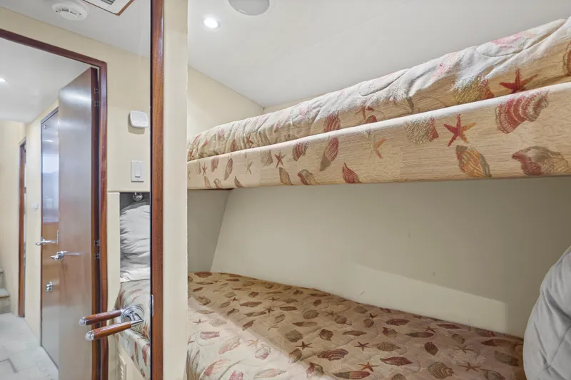 Blacksmith Yacht Photos Pics Bunk beds in 2008 Hatteras 60 Convertible yacht cabin with seashell-themed bedding.