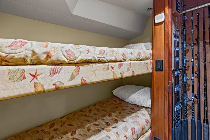Blacksmith Yacht Photos Pics Bunk beds with seashell-patterned bedding in 2008 Hatteras 60 Convertible yacht cabin.