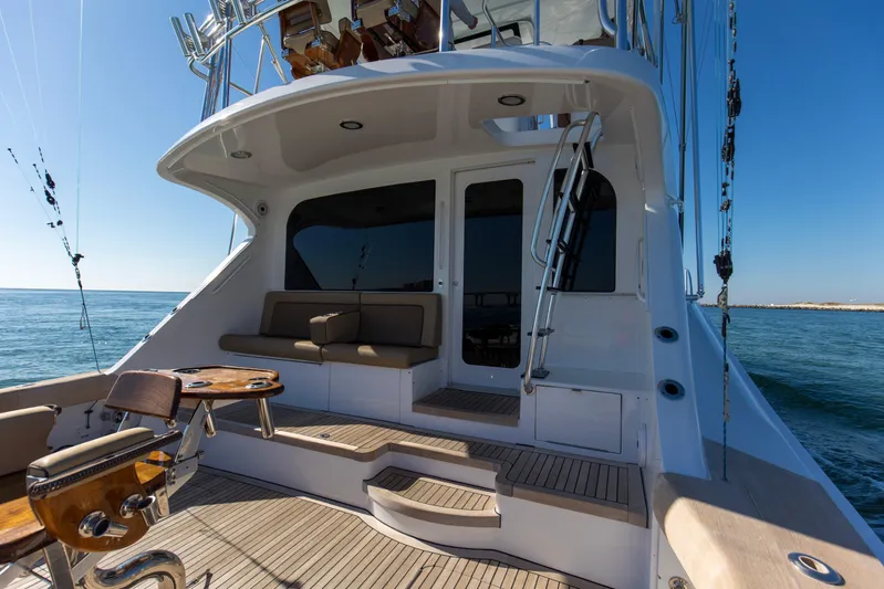 Blacksmith Yacht Photos Pics 2008 Hatteras 60 Convertible yacht deck with seating and fishing equipment.