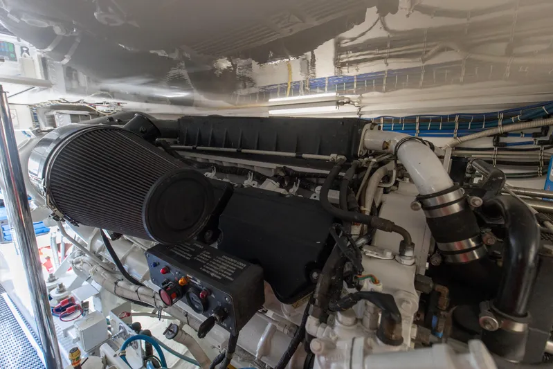 Blacksmith Yacht Photos Pics Engine room of 2008 Hatteras 60 Convertible yacht, showcasing detailed mechanical components.