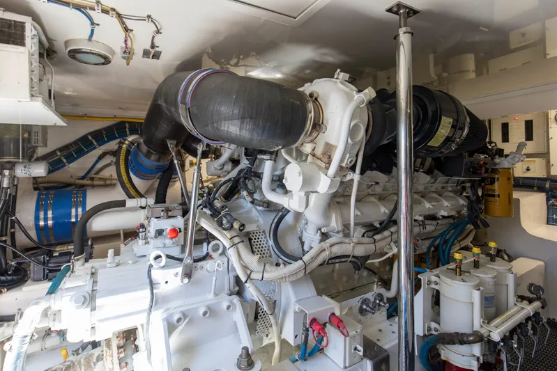 Blacksmith Yacht Photos Pics Engine room of 2008 Hatteras 60 Convertible yacht, showcasing complex machinery and components.