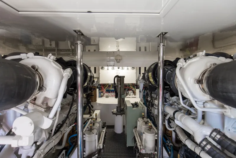 Blacksmith Yacht Photos Pics Engine room of 2008 Hatteras 60 Convertible yacht, showcasing mechanical components and systems.