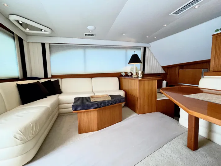 Murphy's Law Yacht Photos Pics Luxurious interior of a 1997 Post 50 Convertible yacht with elegant wood and leather furnishings.