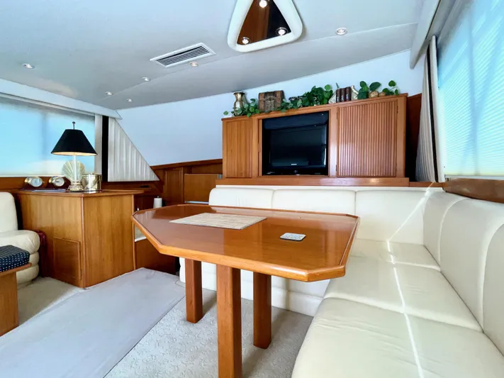 Murphy's Law Yacht Photos Pics Luxurious interior of a 1997 Post 50 Convertible yacht with elegant wood and leather seating.