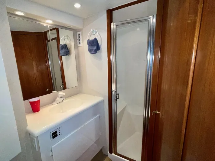 Murphy's Law Yacht Photos Pics Bathroom interior of a 1997 Post 50 Convertible yacht with shower and sink.