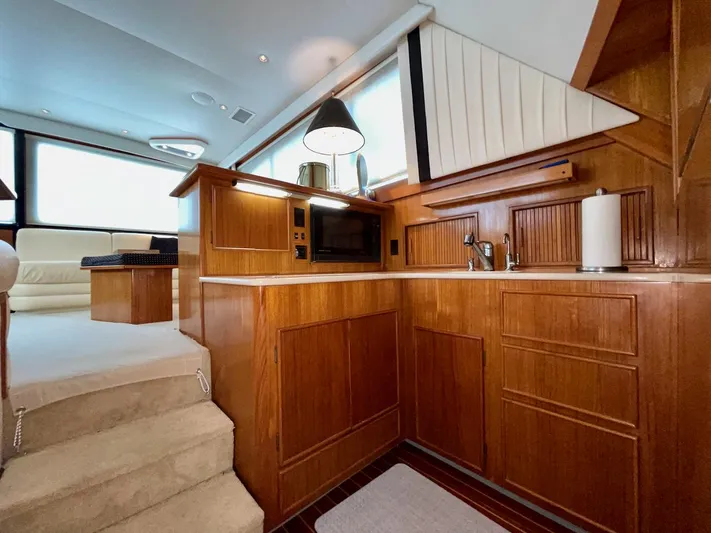 Murphy's Law Yacht Photos Pics Luxurious wooden interior of a 1997 Post 50 Convertible yacht kitchen.