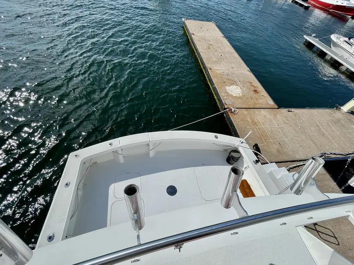 Murphy's Law Yacht Photos Pics 1997 Post 50 Convertible yacht docked at marina, viewed from above.