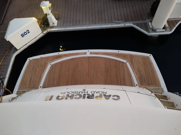 Capricho II Yacht Photos Pics Sunseeker Manhattan 70 yacht stern view at dock, 2011 model.