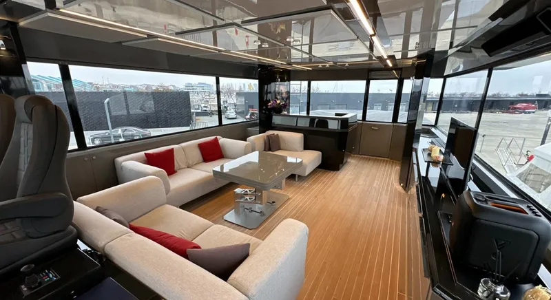  Yacht Photos Pics Luxurious interior of 2017 Arcadia Yachts 100 with modern furnishings and panoramic windows.