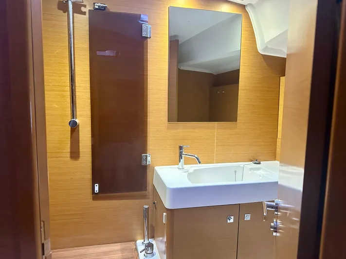 Serendipity Yacht Photos Pics 2014 Jeanneau Sun Odyssey 469 bathroom with modern sink and mirror.
