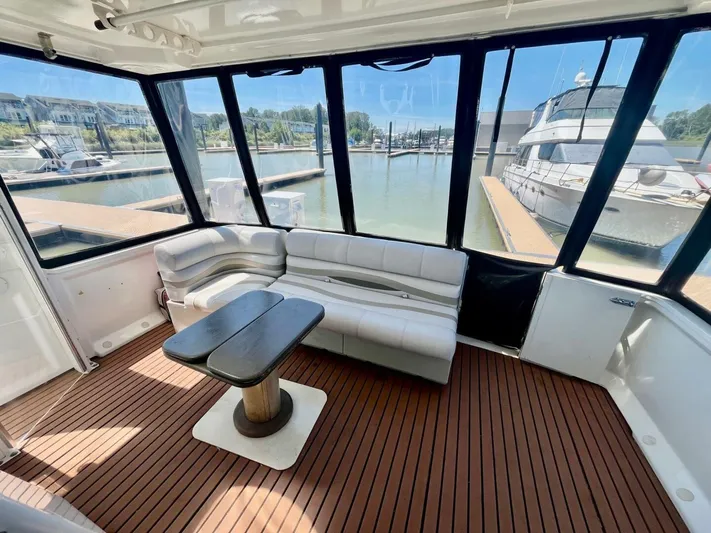  Yacht Photos Pics Luxurious interior of 2001 Carver 404 yacht with elegant seating and marina view.