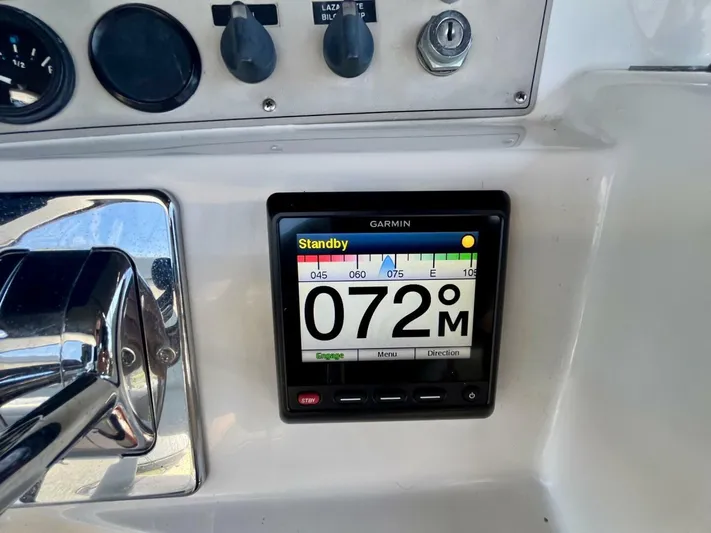  Yacht Photos Pics Garmin navigation display on 2001 Carver 404 boat dashboard, showing heading 072 degrees.