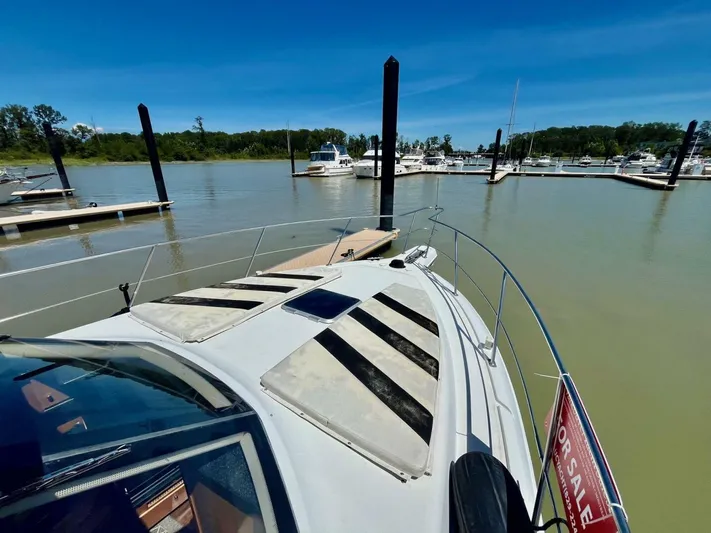  Yacht Photos Pics 2001 Carver 404 yacht docked at marina, sunny day, "For Sale" sign visible.