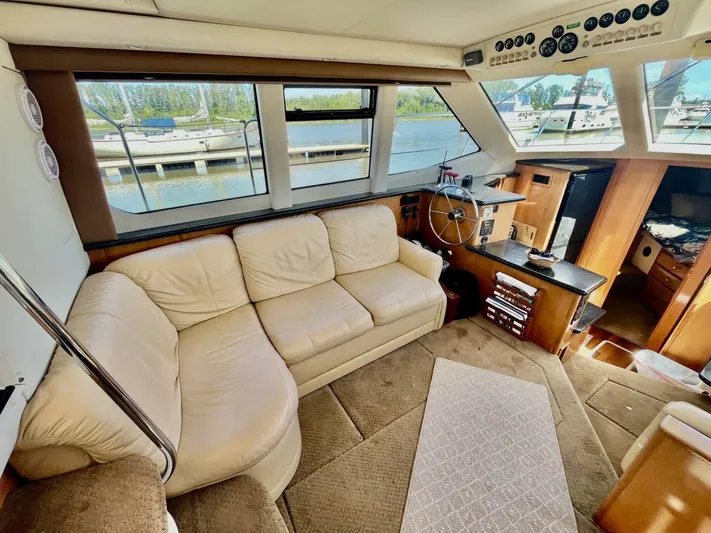  Yacht Photos Pics Luxurious interior of a 2001 Carver 404 yacht with beige leather seating and helm.