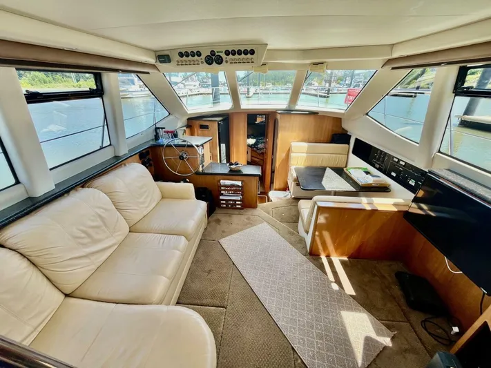  Yacht Photos Pics Luxurious interior of a 2001 Carver 404 yacht with leather seating and panoramic windows.