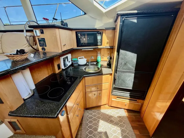  Yacht Photos Pics Luxurious 2001 Carver 404 yacht kitchen with modern appliances and sleek design.