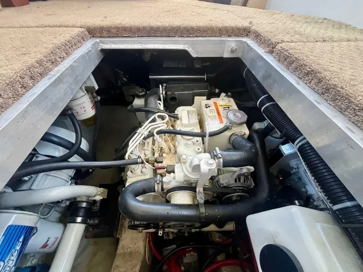  Yacht Photos Pics Engine compartment of a 2001 Carver 404 boat, showcasing mechanical components and wiring.