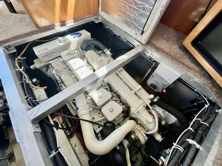  Yacht Photos Pics Engine compartment of a 2001 Carver 404 boat, showcasing mechanical components and wiring.