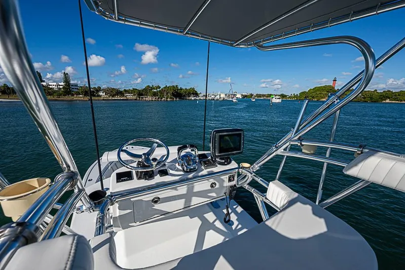  Yacht Photos Pics 2002 Yellowfin 36 Offshore boat helm with ocean view and clear blue sky.