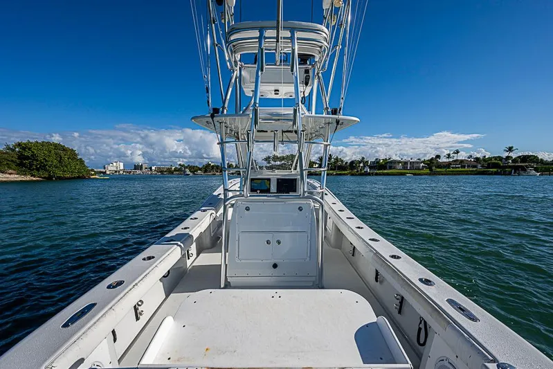 Yacht Photos Pics 2002 Yellowfin 36 Offshore boat on calm water under clear blue sky.
