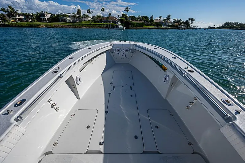  Yacht Photos Pics 2002 Yellowfin 36 Offshore boat on calm water, clear sky, and coastal view.