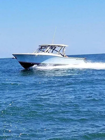 Horse Trader Yacht Photos Pics 2018 Grady-White 307 Freedom boat cruising on open water.