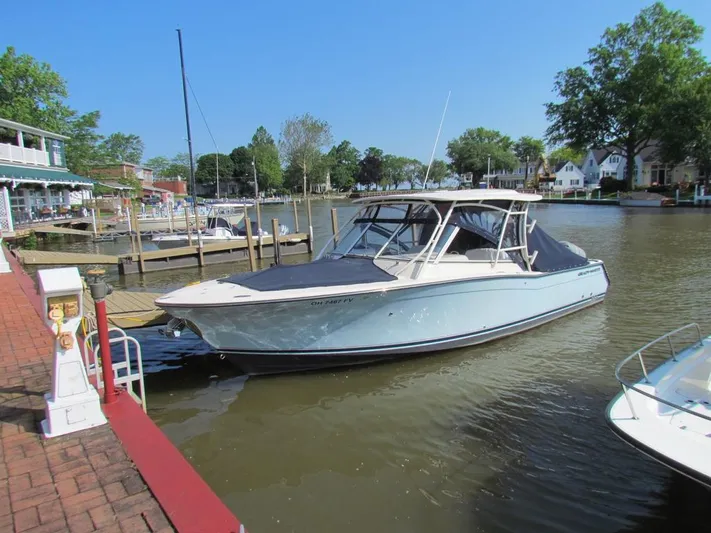 Horse Trader Yacht Photos Pics 2018 Grady-White 307 Freedom boat docked at a scenic marina.