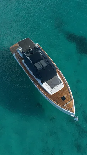 Grace Yacht Photos Pics 2023 Pardo Yachts GT52 cruising on clear turquoise waters, aerial view.