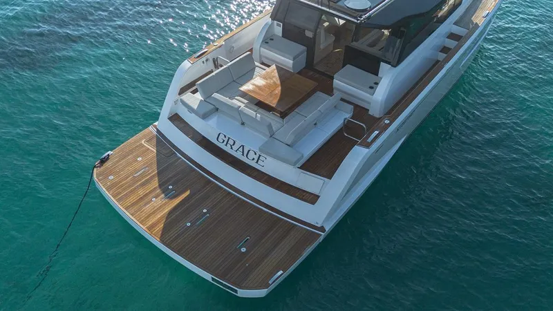 Grace Yacht Photos Pics 2023 Pardo Yachts GT52 luxury yacht on clear blue water, rear view.