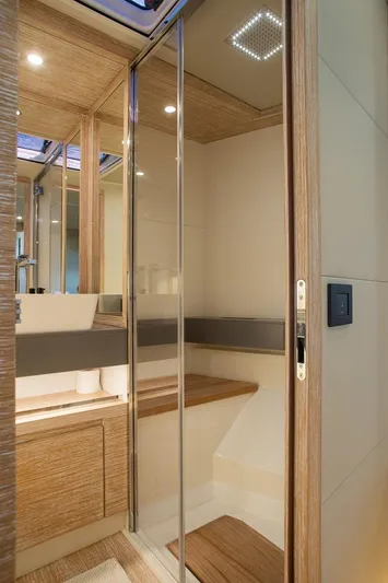 Grace Yacht Photos Pics Luxurious bathroom interior of 2023 Pardo Yachts GT52 with modern wood accents.