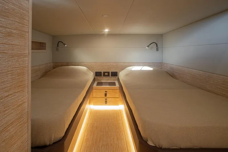 Grace Yacht Photos Pics 2023 Pardo Yachts GT52 cabin with twin beds, modern lighting, and wooden accents.
