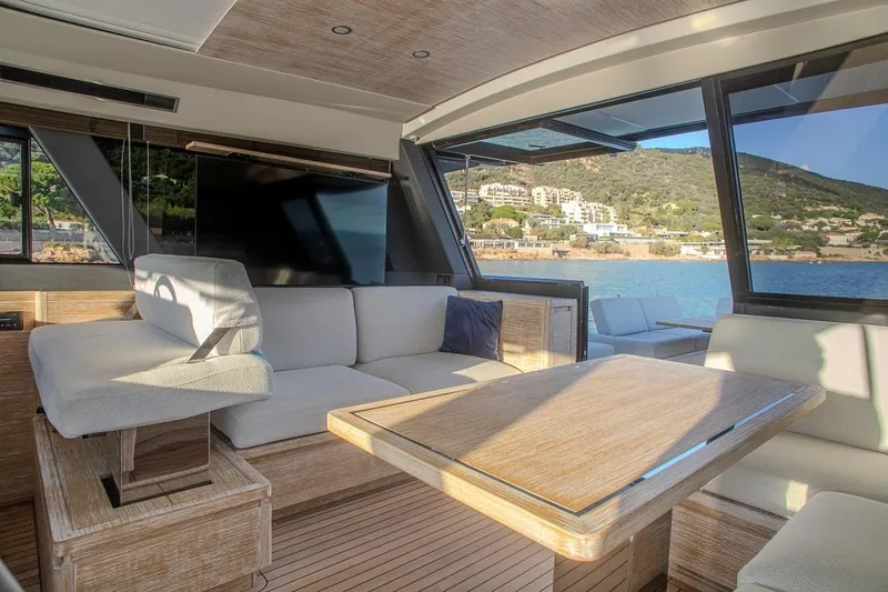 Grace Yacht Photos Pics Luxurious interior of 2023 Pardo Yachts GT52 with elegant seating and scenic ocean view.