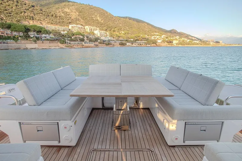 Grace Yacht Photos Pics Luxurious 2023 Pardo Yachts GT52 deck with seating and scenic ocean view.