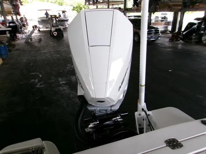  Yacht Photos Pics 2026 Blackfin 242 HB boat engine in a covered storage area.