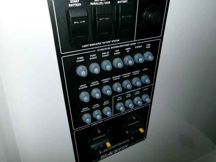  Yacht Photos Pics Control panel of a 2026 Blackfin 242 HB boat with various switches and indicators.